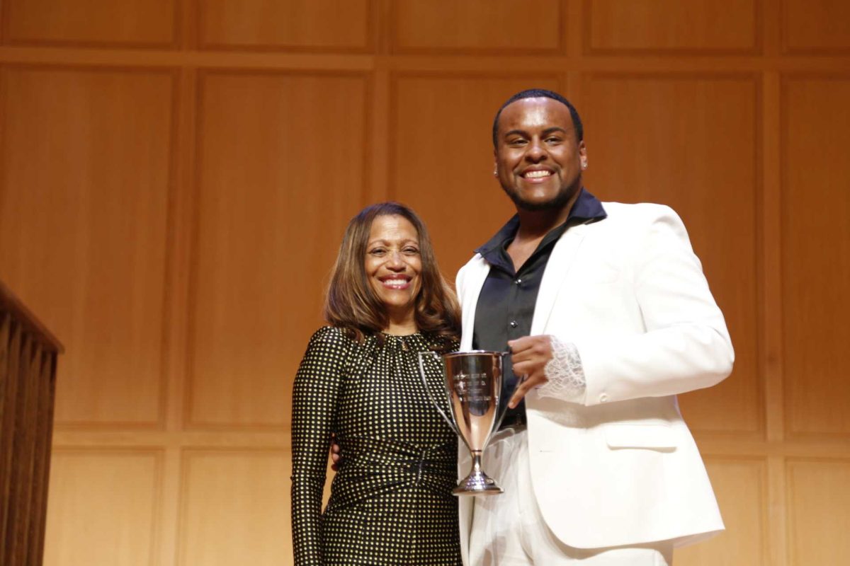 Image of Dr. Lori White (left) alongside 2024 Walker Cup Recipient Aaron Trinidad '24 (right). Credit: Ayusha Pokharel '27. 