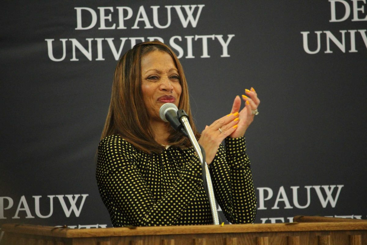 DePauw University President claps along with the crowd after announcing the $200 million gift allocated for the university endowment and the Creative School on Feb. 7, 2024 at the Green Center for Performing Arts. 
