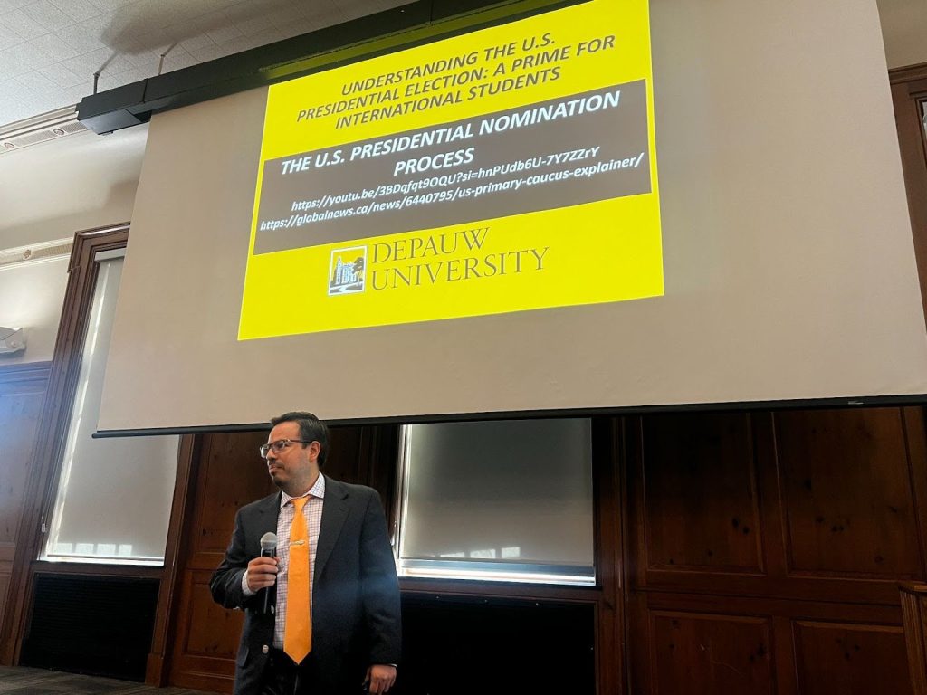 Dr. Javier Juárez-Pérez, assistant professor of political science, presents a primer for international students on Sept. 11 at the Union Building ballroom to promote awareness on U.S. election processes.